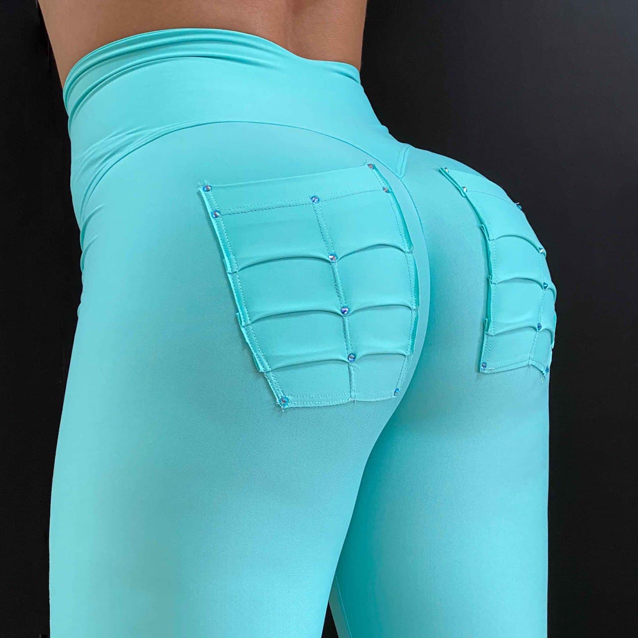 Legging turquesa con bolsillos